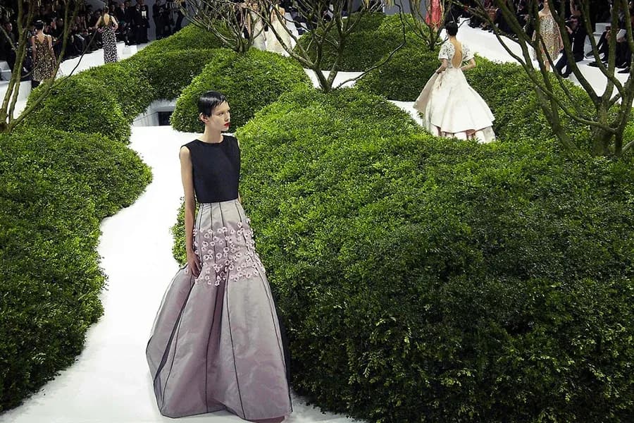 Dior haute couture show models walking through stage 2